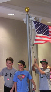 Boys Raising Flag